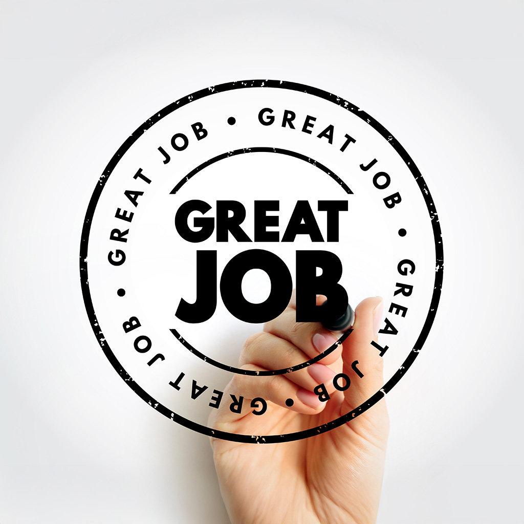 hand with pen writing great job